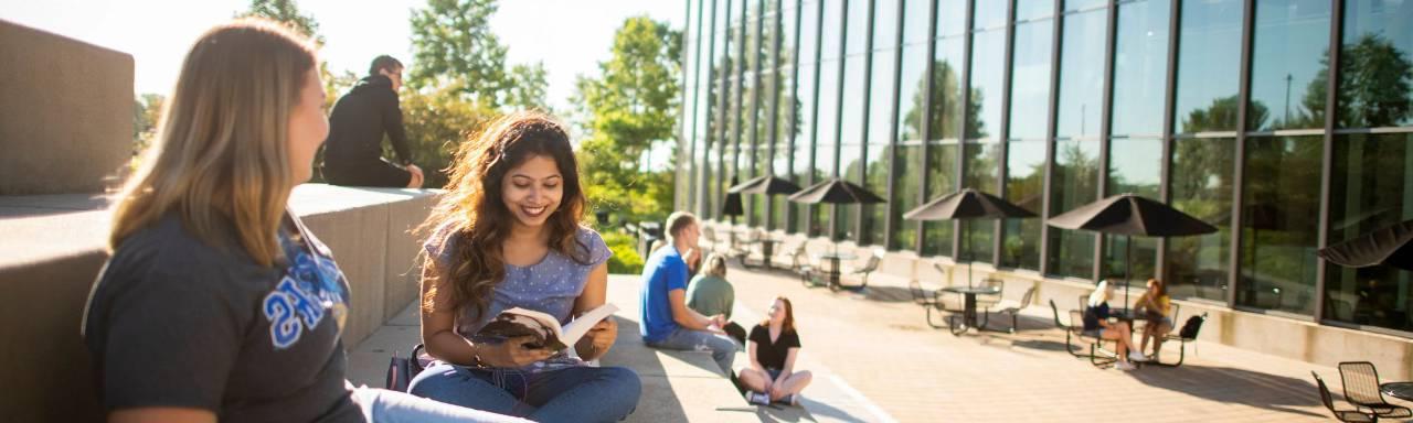 GVSU students studying in front of the library.